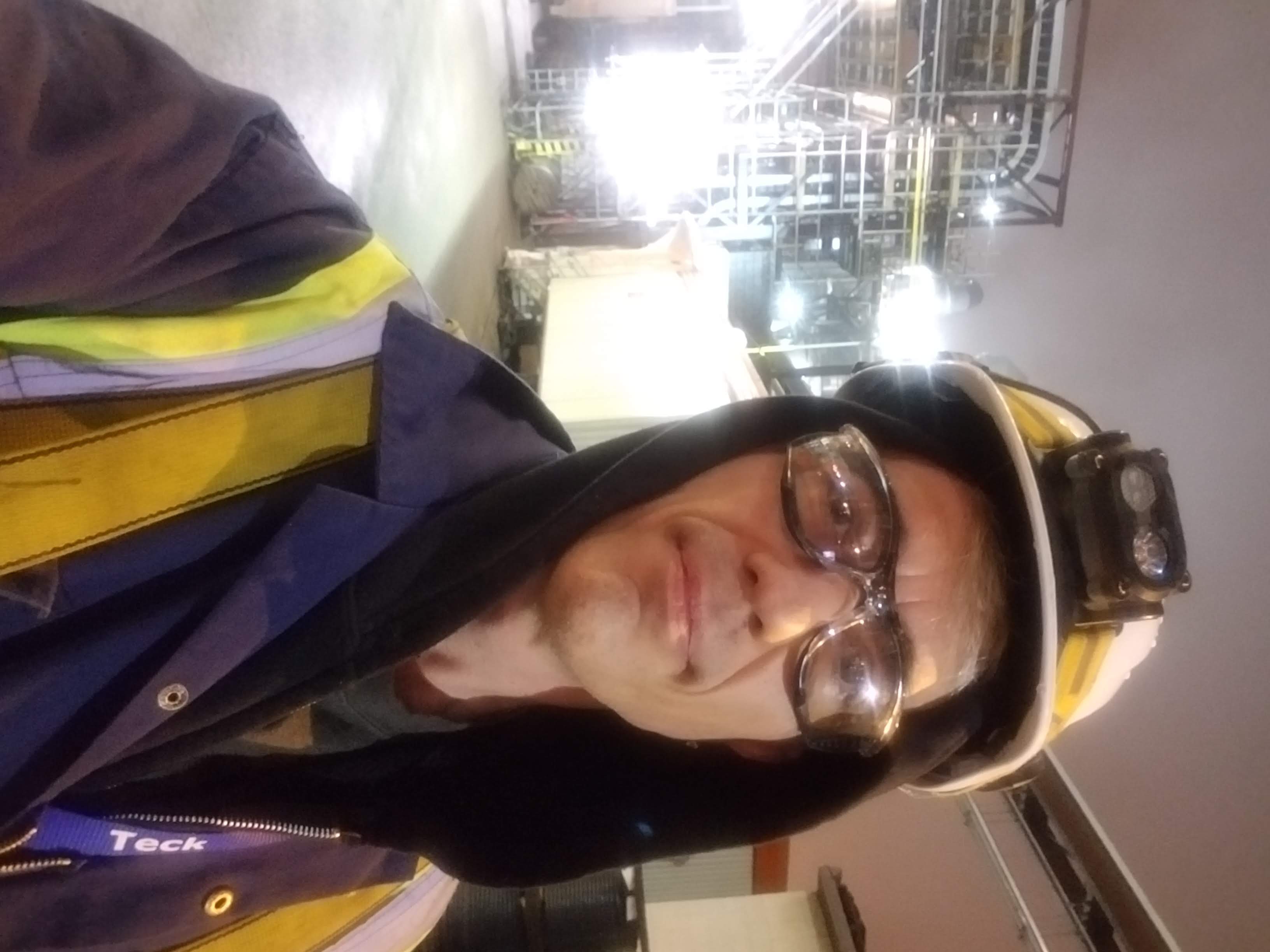 Obadiah Creek in safety gear outside Teck Acid Plant No. 2 during a night shift in 2018.